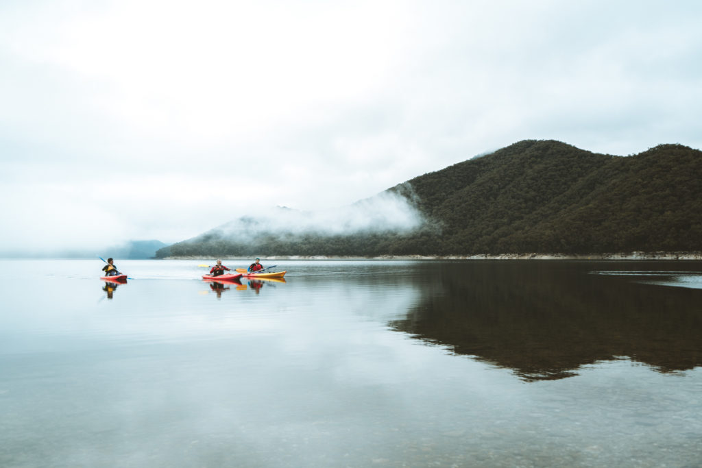 three people kayaking in the Snowy Valleys region