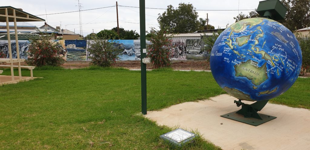 War murals and globe in park in Ungarie, Bland Shire